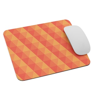 May include: Orange and yellow geometric pattern mouse pad. The mouse pad is made of a soft, durable material and is perfect for protecting your desk from scratches.
