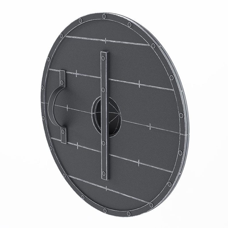 May include: A gray, round shield with a handle and a vertical metal bar. The shield has a series of rivets around the edge and horizontal lines across the surface. The shield is a historical item.