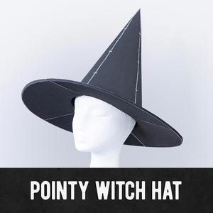 May include: A black pointy witch hat with a wide brim and a tall, conical crown. White stitching details the seams of the hat. The hat is displayed on a white mannequin head against a white background. The text "POINTY WITCH HAT" is at the bottom.