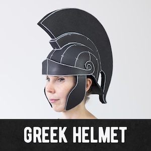 May include: A black Greek helmet featuring a prominent crest, a protective nose guard, and cheek plates. The helmet is constructed with visible white outlines along the edges and seams, giving it a distinct, graphic, and structured appearance.