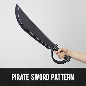 May include: A black pirate sword pattern with a curved blade and a handle with a guard. The sword is held in a hand against a white background. The text "PIRATE SWORD PATTERN" is at the bottom.