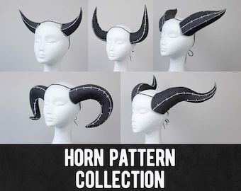 May include: A collection of four black and white devil horn headbands. The horns are made of felt and have a stitched design. The headbands are adjustable and can be worn by people of all ages.