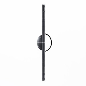 May include: A black and gray shield with a circular handle. The shield has a rounded center and a vertical design with rectangular accents. The background is white.
