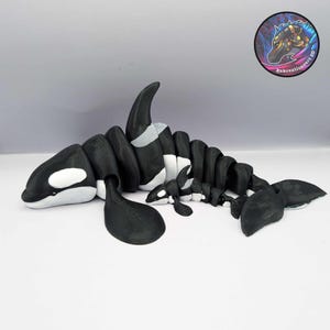 Flexi orca fidget grande ou pequeno
