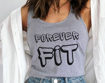 May include: A grey vest top featuring the text "FOREVER FIT" in black bubble letters. The top is paired with a white shirt and blue denim shorts. The outfit has a casual, sporty aesthetic.