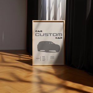 May include: A framed poster with a white background and black text that reads "CAR CUSTOM CAR". The poster features a silhouette of a car in gray. The poster also includes the word "YEAR" and a table with the headings "ENGINE", "POWER", "TORQUE", "TOP SPEED", and "HEIGHT".