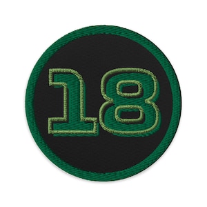 May include: Green and black embroidered patch with the number 18 in a circle.