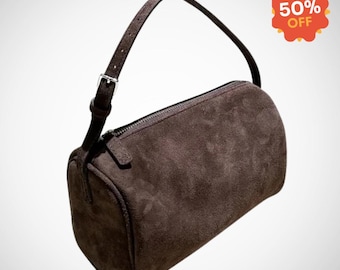 Bolso de mano minimalista de ante y piel de cordero