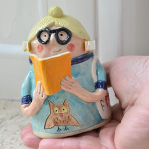 May include: A weathered wooden sign, inscribed with 'Welcome to our home' in white. The sign has a distressed appearance, ideal for a porch or hallway, creating a welcoming atmosphere.