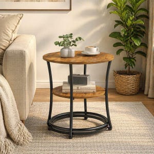 May include: A two-tiered round side table with a dark brown wood top and shelf, supported by black metal legs. The table has a circular base and holds a small plant, books, and a coffee cup. The table is approximately 24 inches tall.