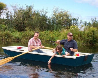 May include: Three people in a blue and white wooden rowboat on a lake. The person in the back is holding a fishing rod. The person in the middle is holding a fishing rod and the person in the front is rowing.