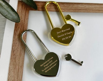 May include: Two heart-shaped padlocks with keys. One padlock is gold and engraved with "Just Married Dustin & Cayla 09.28.24". The other padlock is silver and engraved with "Marybeth and loan Prague 2024 To infinity and beyond Missing beyond".