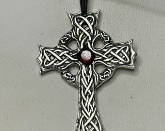 Silver Celtic cross engraved with Celtic knot and set with garnet