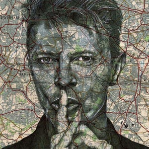 May include: A black and white portrait of a man with a map of London superimposed over his face. The man is looking directly at the viewer and has his finger to his lips, as if to say "shhh".