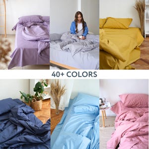 May include: A variety of bedding sets in different colors, including purple, gray, yellow, blue, and pink. The bedding sets include a duvet cover, pillowcases, and a fitted sheet. The image also includes the text "40+ COLORS".