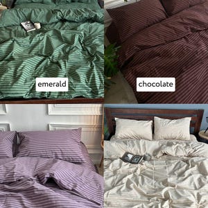 May include: Four bedding sets in emerald, chocolate, purple, and beige. Each set includes striped pillowcases and a comforter. The emerald and beige sets have books on the bed. The sets are displayed on wooden bed frames.