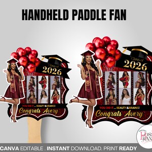 May include: Handheld paddle fan with a graduation theme. The fan features a graduate in a maroon dress, a mortarboard, and red balloons. The text reads "Class of 2026" and "Congrats Avery."