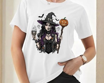 May include: White t-shirt with a Halloween graphic. The design shows a witch with purple hair, a black hat with skulls, a carved pumpkin, and a goblet. Bats and ghosts are also part of the illustration.