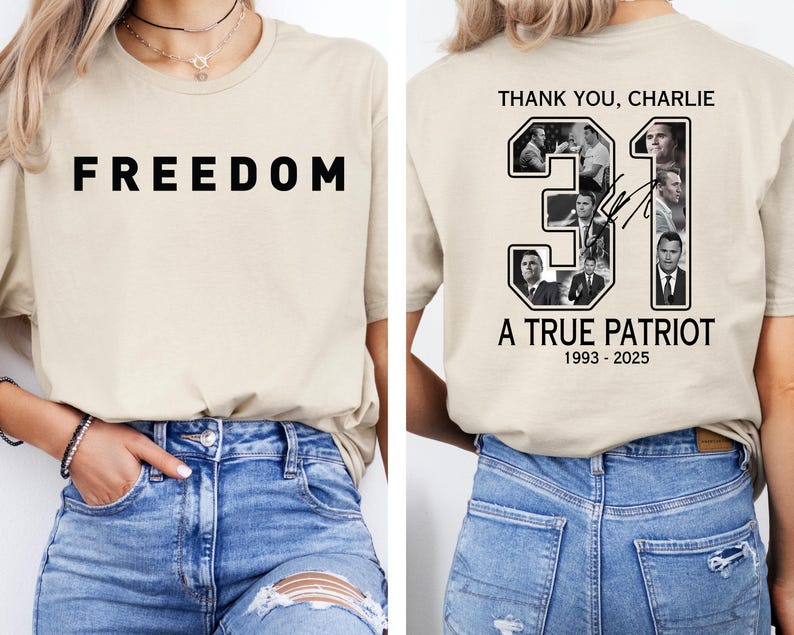 May include: A beige t-shirt with the word "FREEDOM" in bold black letters on the front. The back of the shirt features a design with the text "THANK YOU, CHARLIE", the number "31", and the words "A TRUE PATRIOT 1993-2025".
