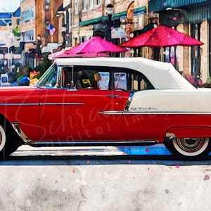 May include: A red and white 1955 Chevrolet Bel Air convertible with a white top, parked on a street in front of a building. The car is in a watercolor style.
