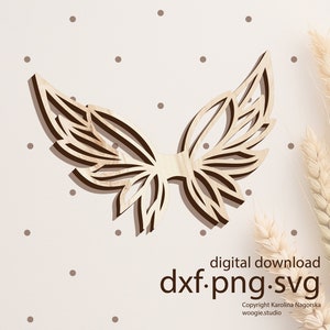May include: A digital download of a decorative wooden butterfly wing design in a light brown color. The design is intricate and detailed, with a layered effect. The image includes the text "dxf.png.svg" and "digital download".