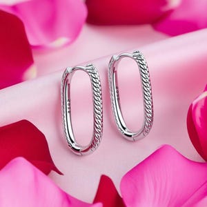 May include: A distressed wooden sign, inscribed with "Welcome to our home" in white. The sign has a rustic finish, ideal for a porch or hallway, creating a welcoming atmosphere.