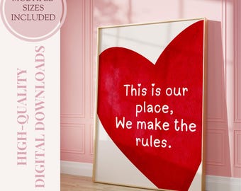 May include: A printable wall art design featuring a red heart with the text "This is our place, We make the rules." in white lettering.