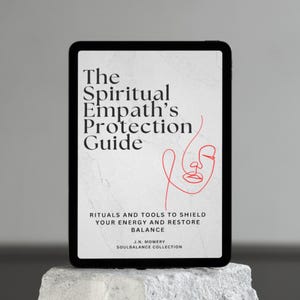 Puede incluir: Una tableta digital muestra la portada de "The Spiritual Empath's Protection Guide". La portada presenta el título en negrita, un dibujo lineal rojo de un rostro y el subtítulo "Rituals and Tools to Shield Your Energy and Restore Balance."