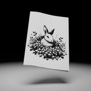 Puede incluir: Ilustración en blanco y negro de un conejo sentado en un arbusto de bayas. El conejo mira hacia la izquierda y tiene una cola esponjosa.