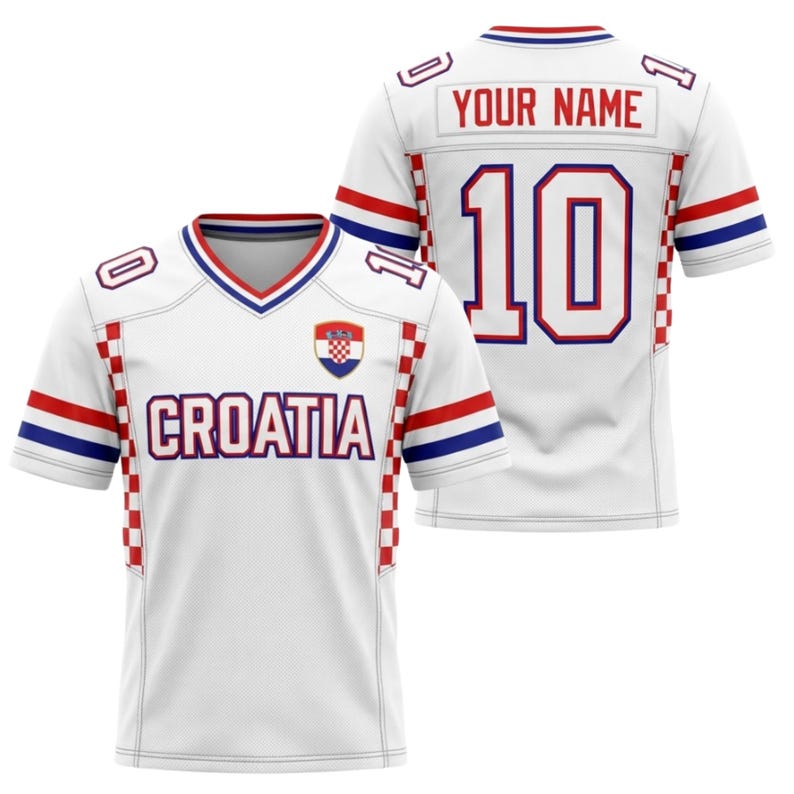 May include: White Croatia football jersey with red and blue detailing. The jersey displays the word "CROATIA" across the chest and the number "10" on the back. It also has a Croatian coat of arms patch.
