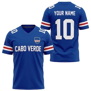 May include: Two blue Cabo Verde jerseys. One jersey has the text "CABO VERDE" and a shield logo on the front. The other jersey has the text "YOUR NAME" and the number "10" on the back. Both jerseys have white and red stripes on the sleeves.