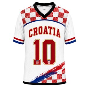 May include: A white V-neck jersey featuring the word CROATIA in red letters above the number 10. The shoulders and bottom right corner display a red and white checkered pattern. The sleeves have red, white, and blue stripes at the cuffs.