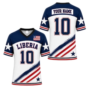 May include: A short-sleeve V-neck jersey featuring a white base with navy blue shoulders and sleeves. The front displays the text LIBERIA and the number 10 with a small Liberian flag. The back shows the text YOUR NAME and the number 10.