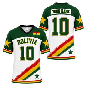 May include: A white and green V-neck jersey featuring the text BOLIVIA and the number 10 on the front, with a Bolivian flag emblem. The back displays the text YOUR NAME and the number 10. The design includes yellow stars and a diagonal tricolor stripe.