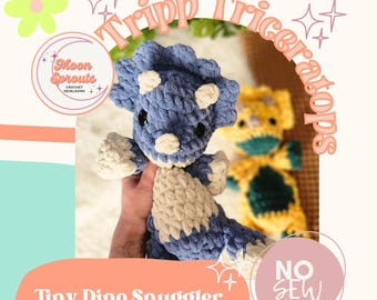 May include: A crochet pattern for a blue and white triceratops dinosaur toy. The pattern is called "Tripp Triceratops" and is a "Tiny Dino Snuggler" crochet pattern. The pattern is from Moon Sprouts Crochet Heirlooms and is a no-sew project.