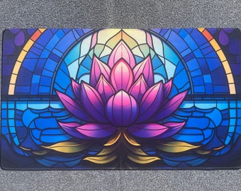 May include: A stained glass style mousepad featuring a purple and pink lotus flower with gold accents. The background is a blue and white stained glass pattern.