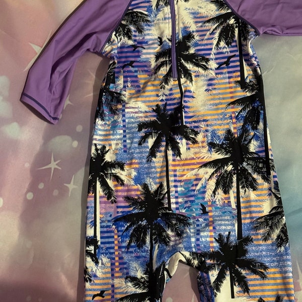 girls body glove style, one piece front zip Hawaiian purple girls size medium swimsuit with shorts and sleeves rad