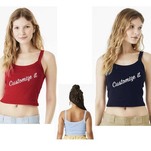 May include: Two women's tank tops with the text "Customize it" in white script. The tank top on the left is red and the tank top on the right is navy blue.