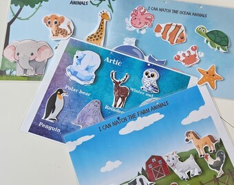 Puede incluir: Un conjunto de cuatro juegos educativos de emparejamiento coloridos para niños. Cada juego presenta un tema diferente: Animales de la sabana, Animales marinos, Animales del Ártico y Animales de granja. Los juegos incluyen ilustraciones coloridas de animales y el texto "Puedo emparejar los... animales".