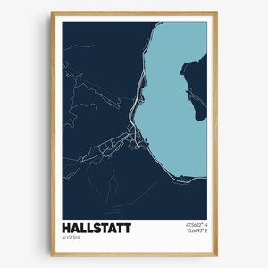 May include: A dark blue map of Hallstatt, Austria, with a light blue lake and white lines showing the roads and streets. The coordinates 47.5622° N 13.6493° E are printed in the bottom right corner.