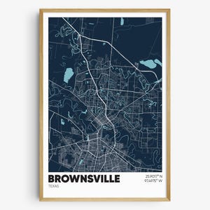 May include: A dark blue map print of Brownsville, Texas, with white lines showing the city streets and waterways. The city name is printed in white at the bottom of the map, along with the coordinates 25.9017° N 97.4975° W.