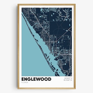 May include: A framed map of Englewood, Florida, with a blue and white color scheme. The map shows the city's streets and waterways. The text "ENGLEWOOD, FLORIDA" and the coordinates "26.9620° N 82.3526° W" are printed below the map.