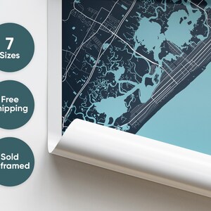 May include: A blue and white city map print with the text "7 Sizes", "Free Shipping", and "Sold Unframed".