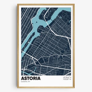 May include: A blue and white map print of Astoria, Queens, New York. The map shows the streets and waterways of the neighborhood. The text "ASTORIA" and "QUEENS, NY" is printed below the map. The coordinates "40.7644° N 73.9235° W" are printed below the text.