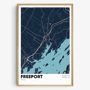 May include: A blue and white map print of Freeport, Maine. The map shows the town's streets and waterways. The text "FREEPORT" and "MAINE" are printed at the bottom of the map. The coordinates "43.8570° N 70.1031° W" are printed in the bottom right corner.