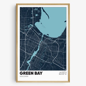 May include: A navy blue and light blue map print of Green Bay, Wisconsin. The map shows the city's streets, waterways, and surrounding area. The text "GREEN BAY" and "WISCONSIN" are printed below the map, along with the coordinates "44.5133° N 88.0133° W".
