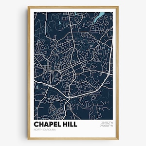 May include: A dark blue map print of Chapel Hill, North Carolina, with white lines showing the streets and roads. The city name and state are printed in white at the bottom of the map. The coordinates 35.9132° N 79.0558° W are printed in white in the top right corner.