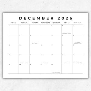 May include: A black and white wall calendar page for December 2026. The grid displays days of the week from Sunday to Saturday. It includes text for holidays and lunar phases such as Hanukkah, New Moon, Winter Solstice, Full Moon, Christmas, Kwanzaa, and New Year's Eve.