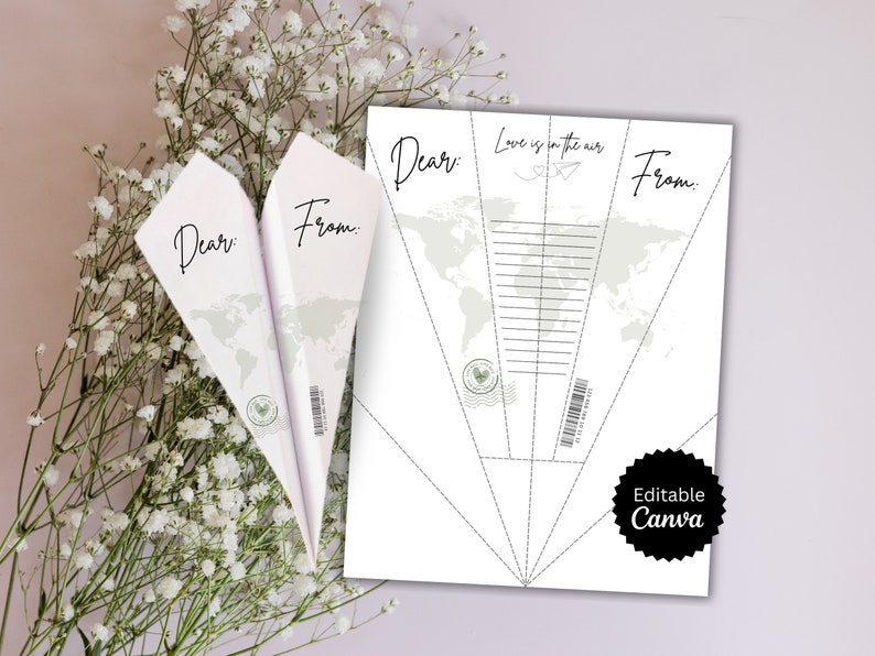May include: Printable DIY paper airplane template with a world map design. The template includes the text "Dear:" and "From:" and the phrase "Love is in the air". The template is labeled "Editable Canva".