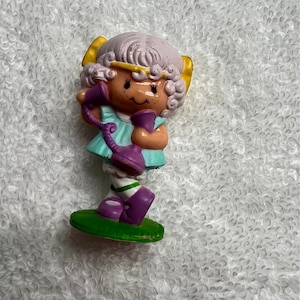 May include: A set of three ceramic mugs with a speckled, matte finish. The mugs are in shades of cream, light gray, and dark gray. Each mug has a simple, minimalist design and a rounded handle.